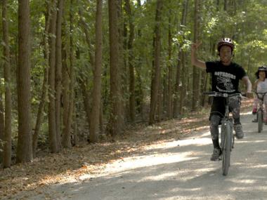 Kids riding their bikes down Delta Heritage Trail