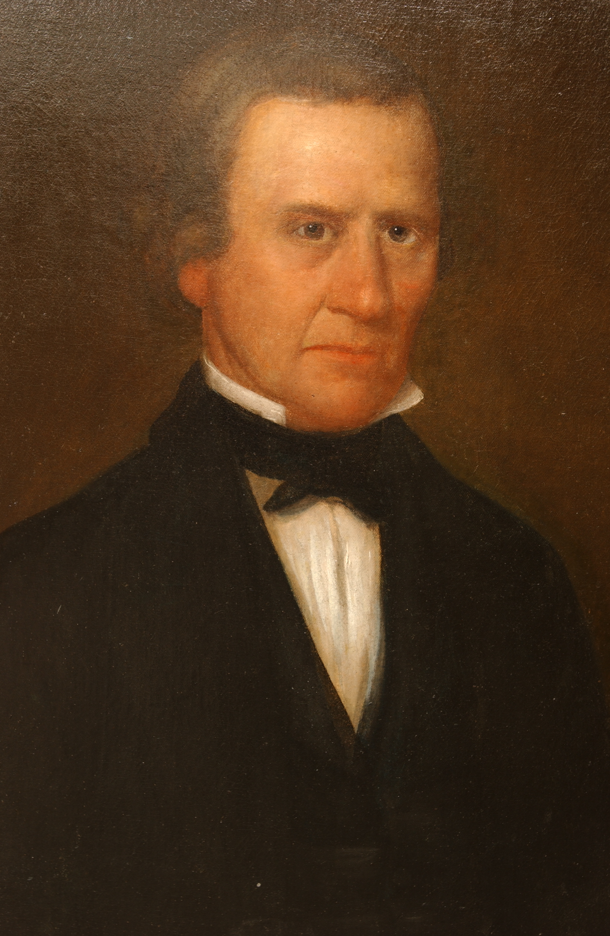 Painted portrait of Cephas Washburn with solemn face, wearing black suit