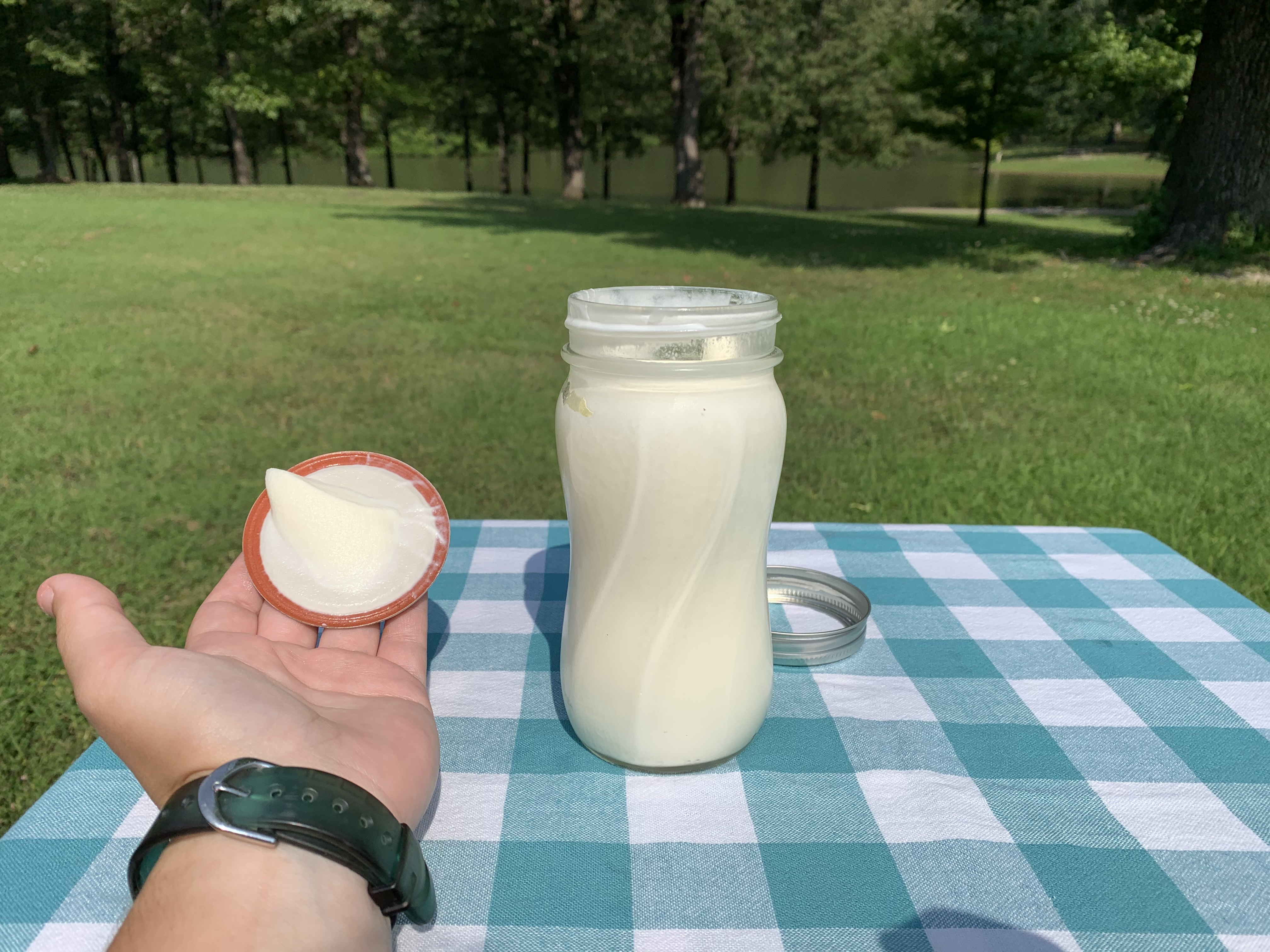 on the table is a mason jar filled with fluffy cream).