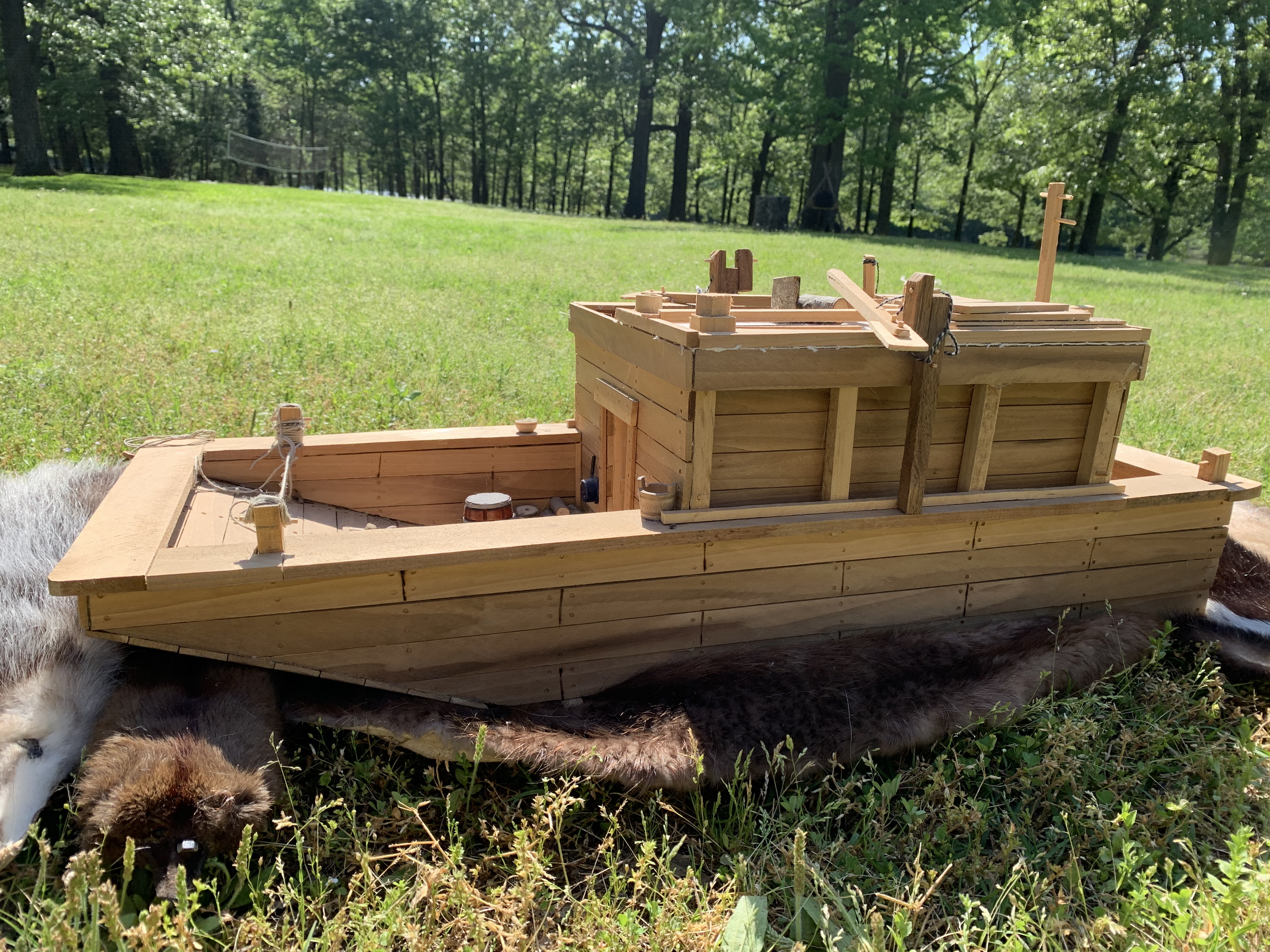 Side view of a small flatboat replica 