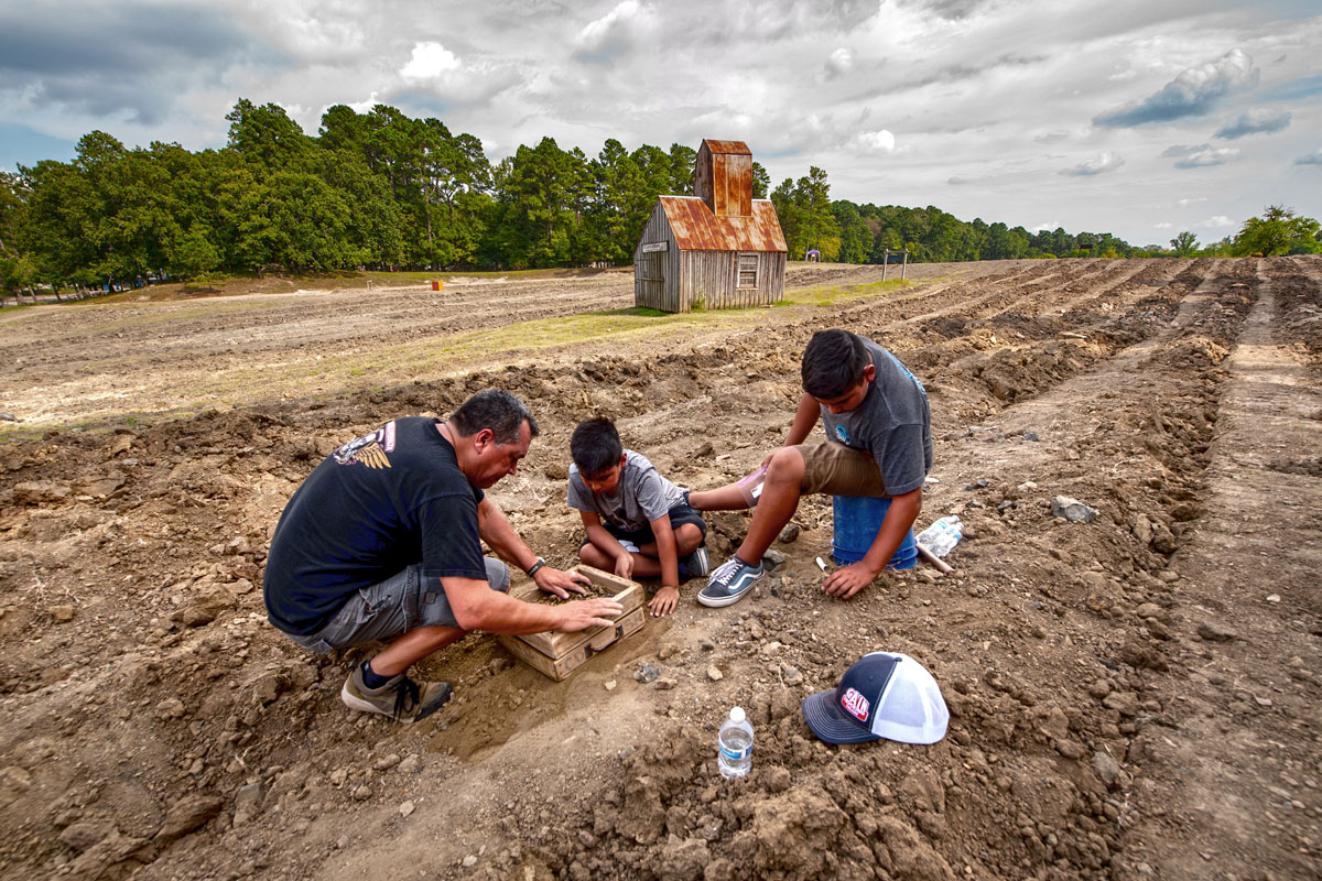 family searching for diamonds in the search field