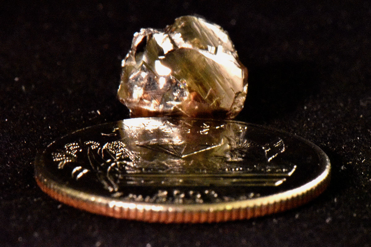 Kinard Friendship Diamond next to quarter for scale