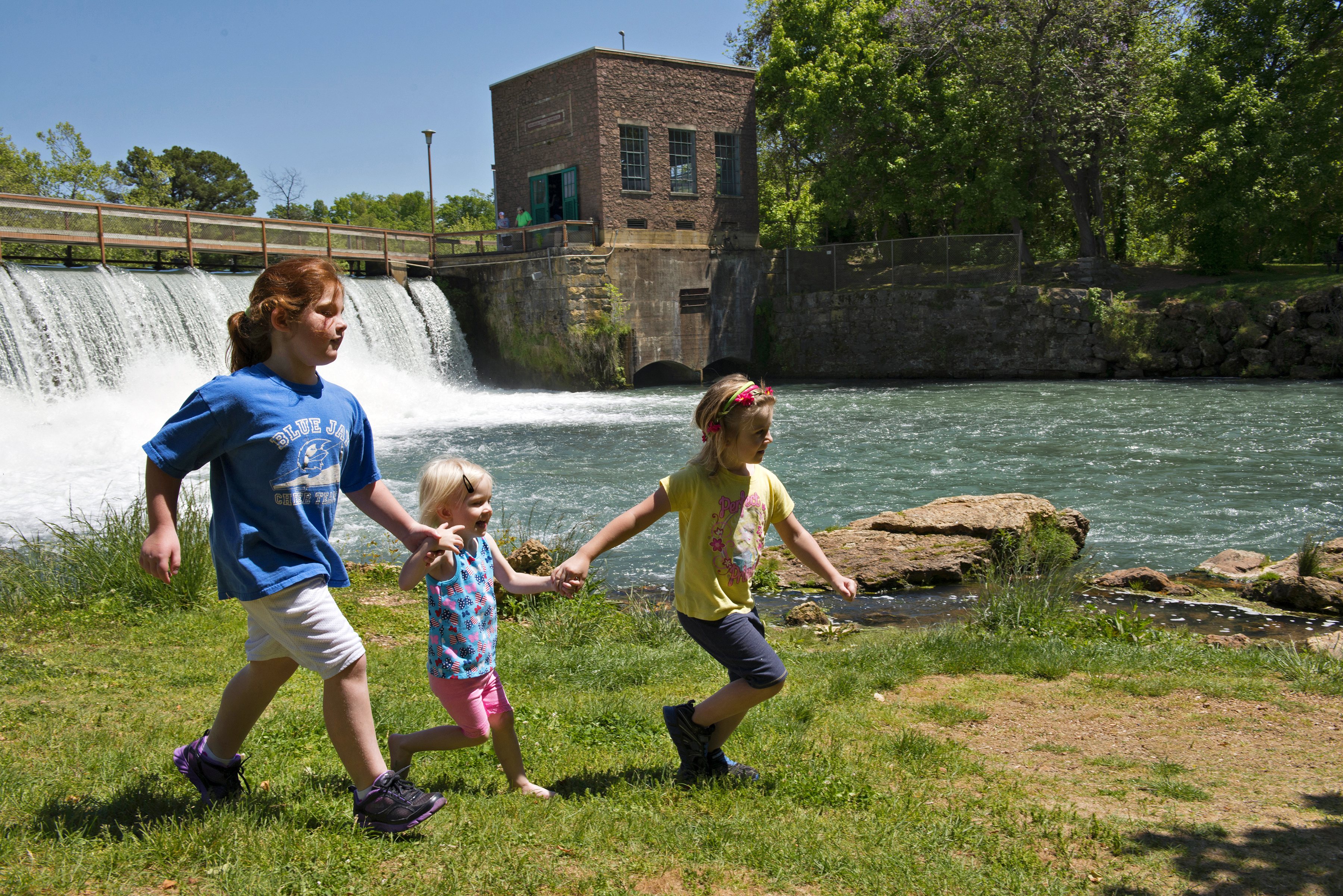 Children walking near the Mammoth Spring spillway