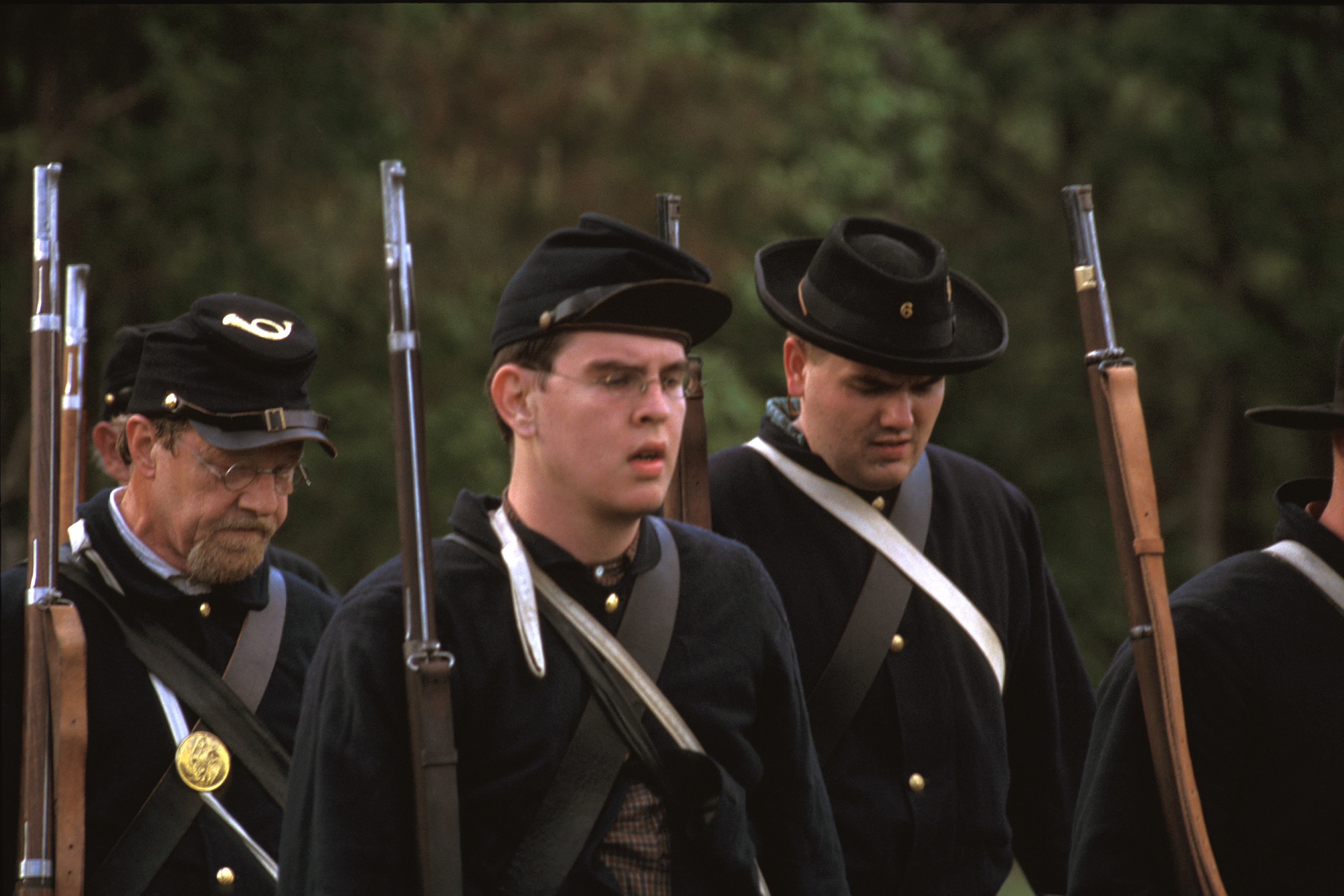 A closeup of Civil War reenactors walking across the battlefield at Marks Mills 