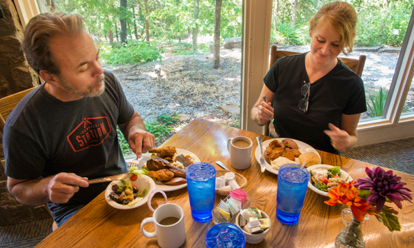 Couple eating delicious fried chicken at the Skillet Restaurant at Ozark Folk Center State Park
