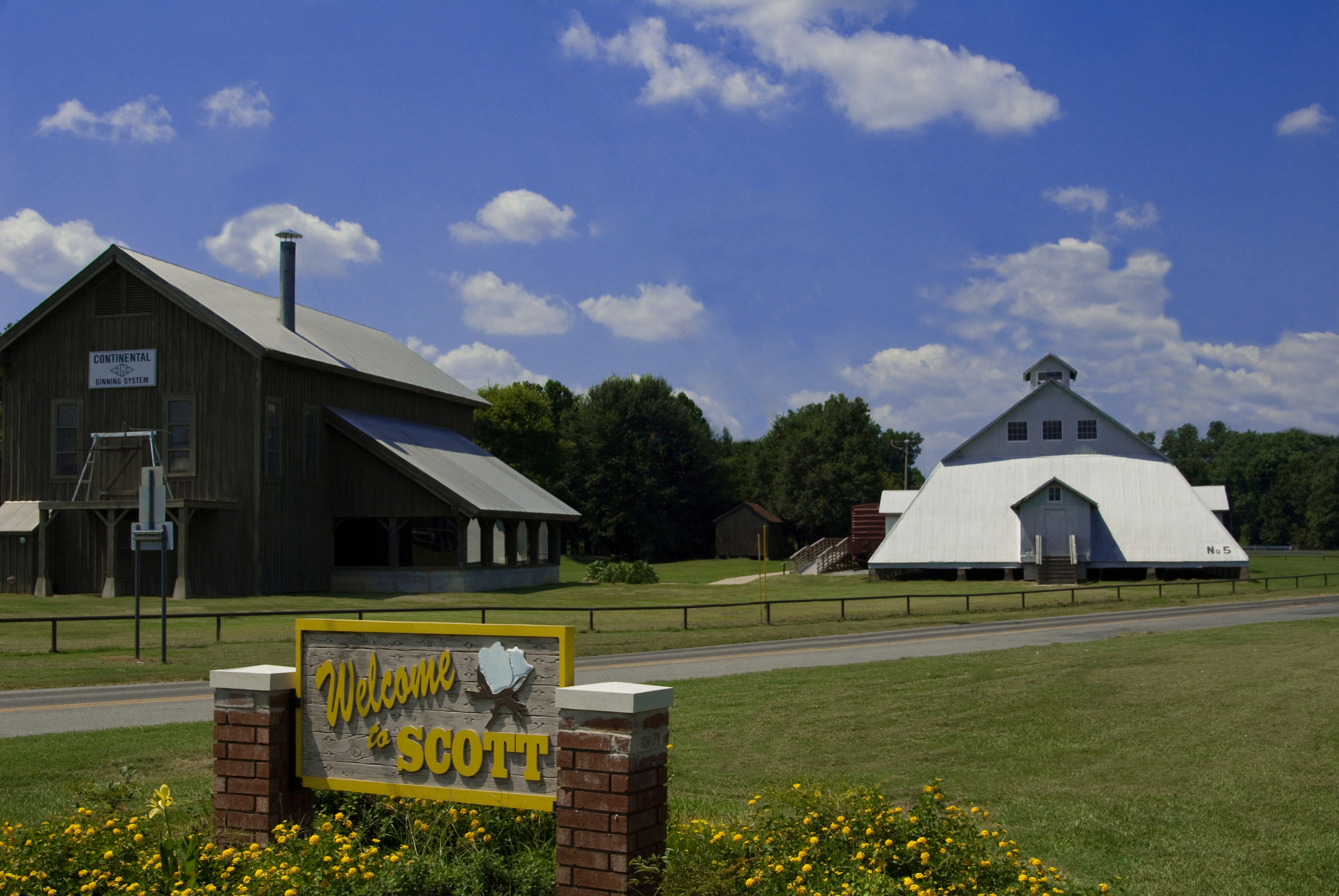Visitor looking at equipment outside of the Plantation Agriculture Museum