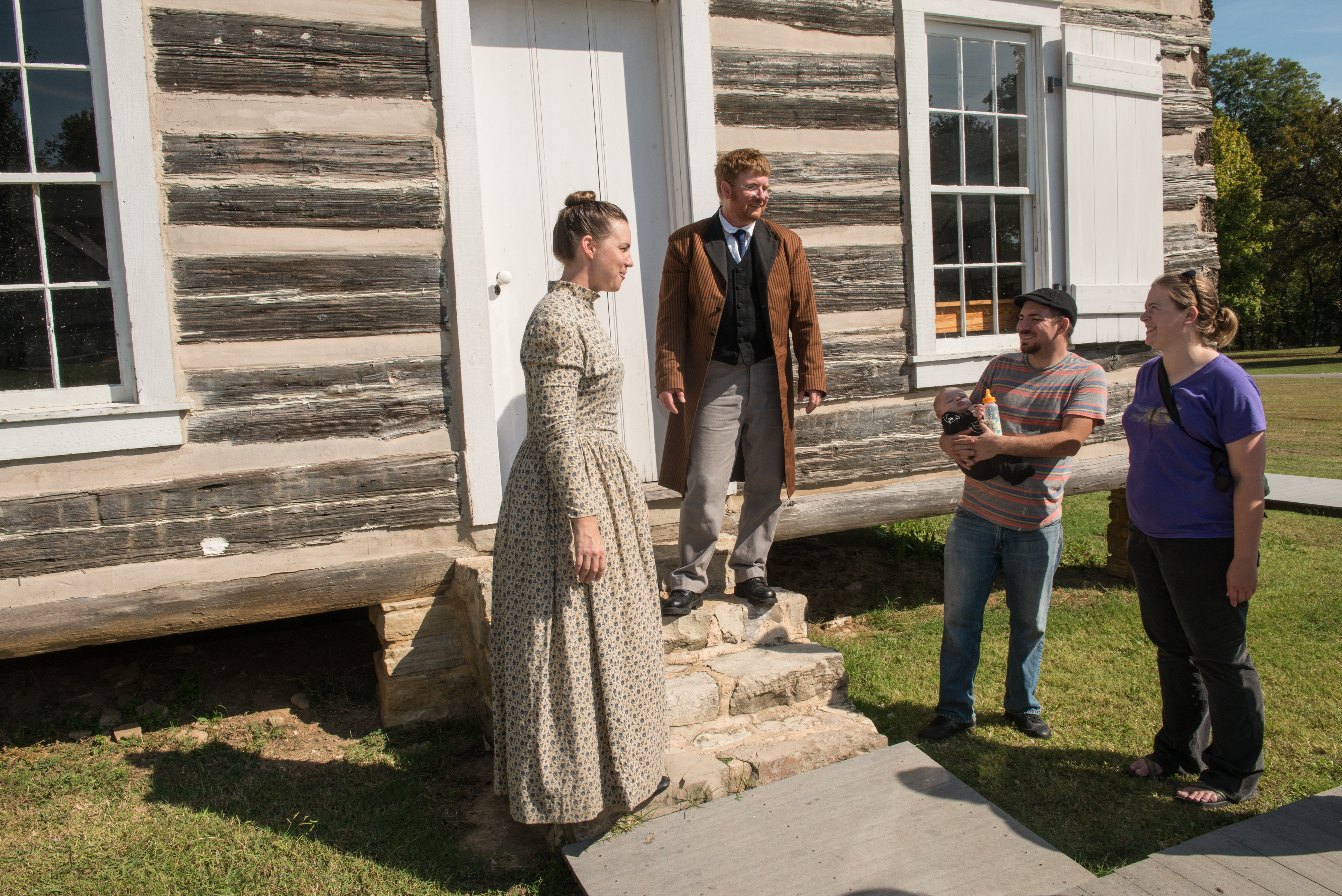 Reenactors talking to guests outside of the Courthouse
