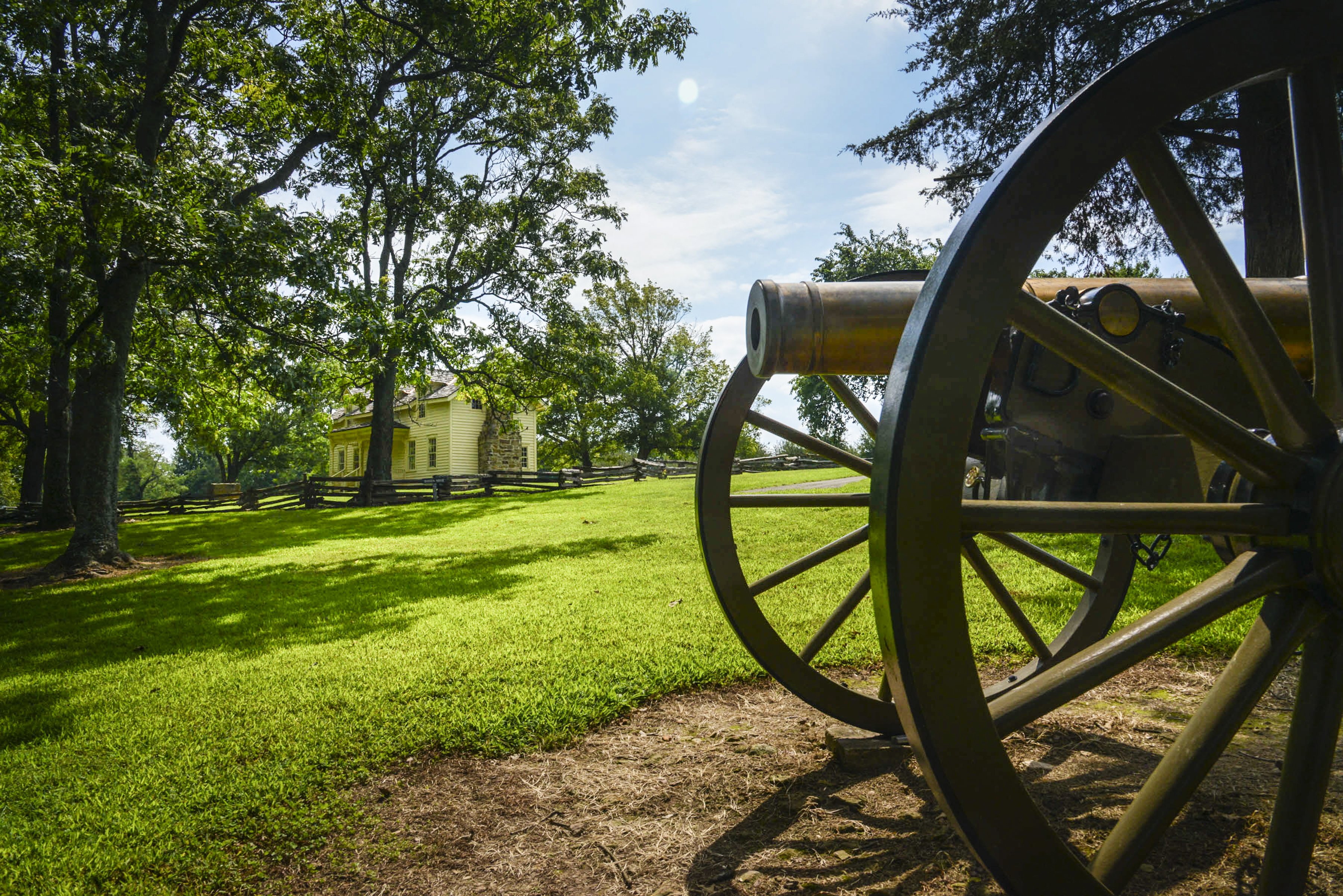 Cannon on display in a field at Prairie Grove Battlefield State Park