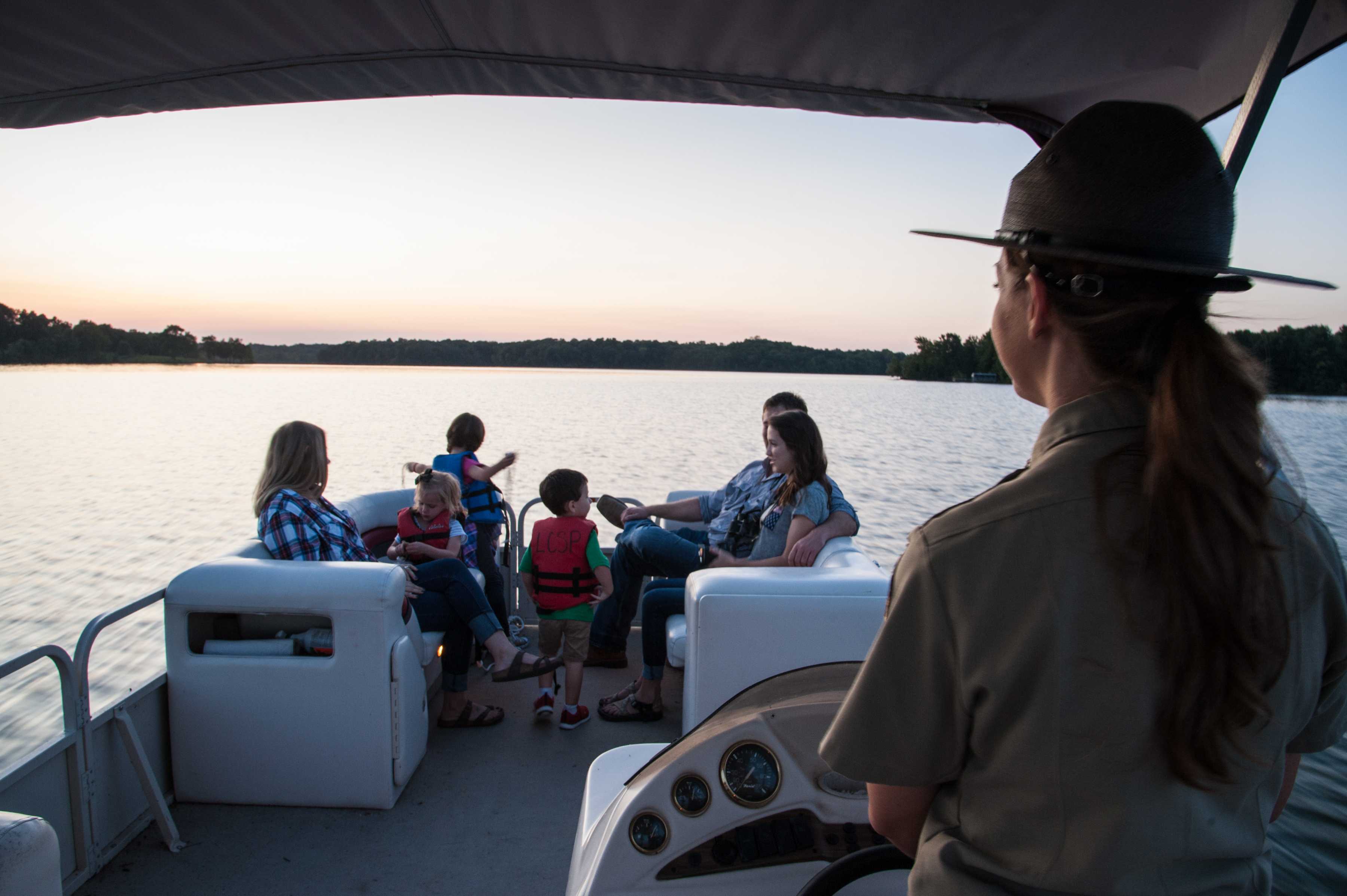 Family taking a sunset cruise on Lake Charles