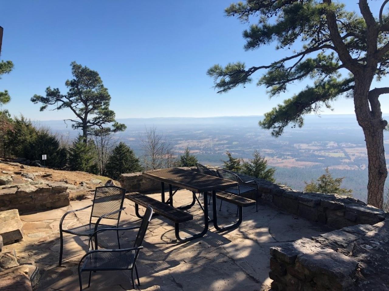 A view of the outdoor seating and view from the back of Cabin 3 at Mount Nebo State Park