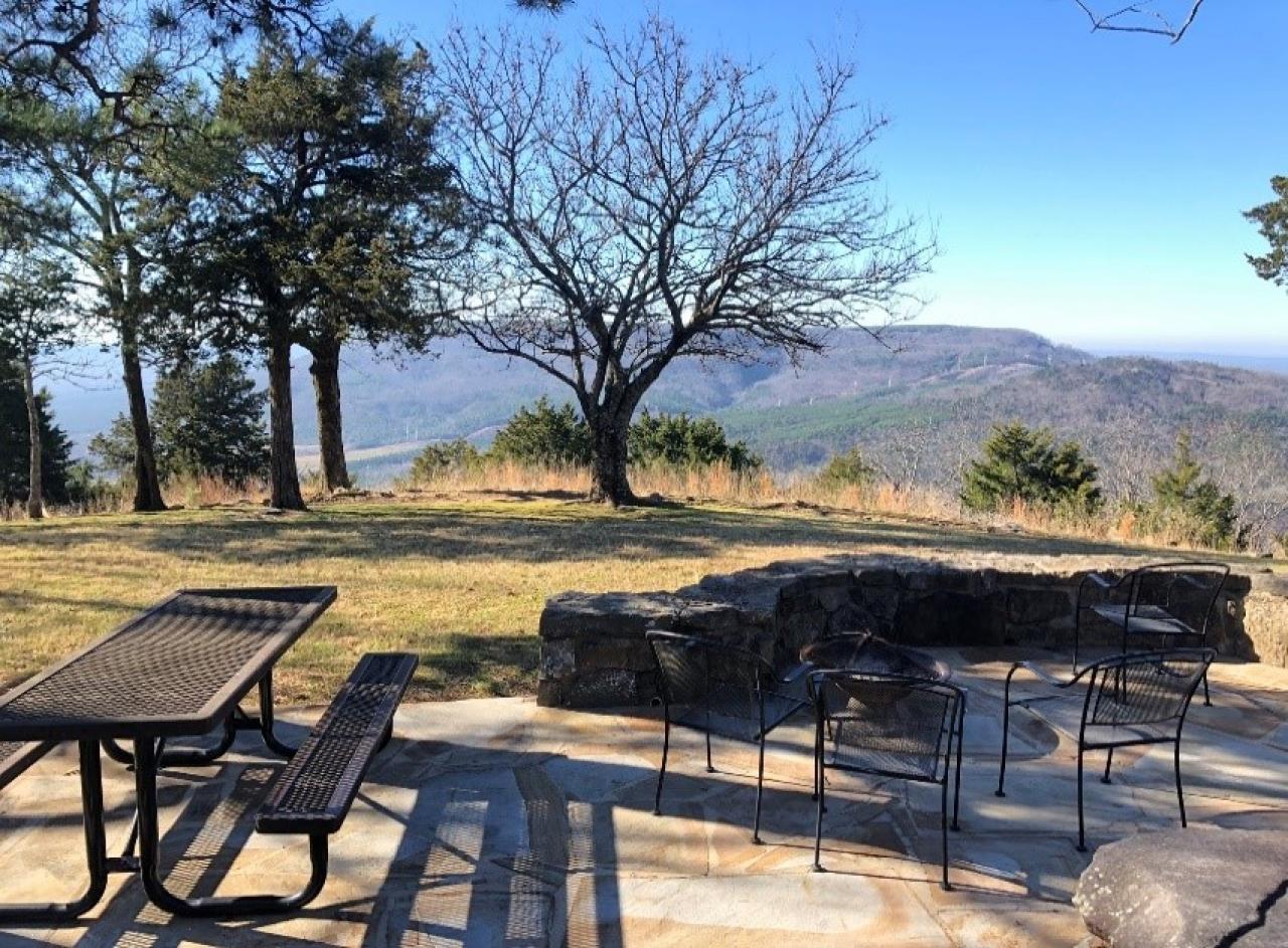 A view of the outdoor seating with a view at Cabin 4 at Mount Nebo State Park