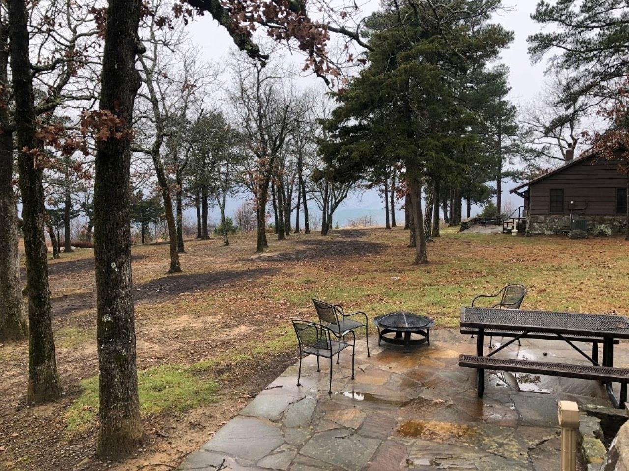 Outdoor seating area and firepit at Cabin 12 at Mount Nebo State Park