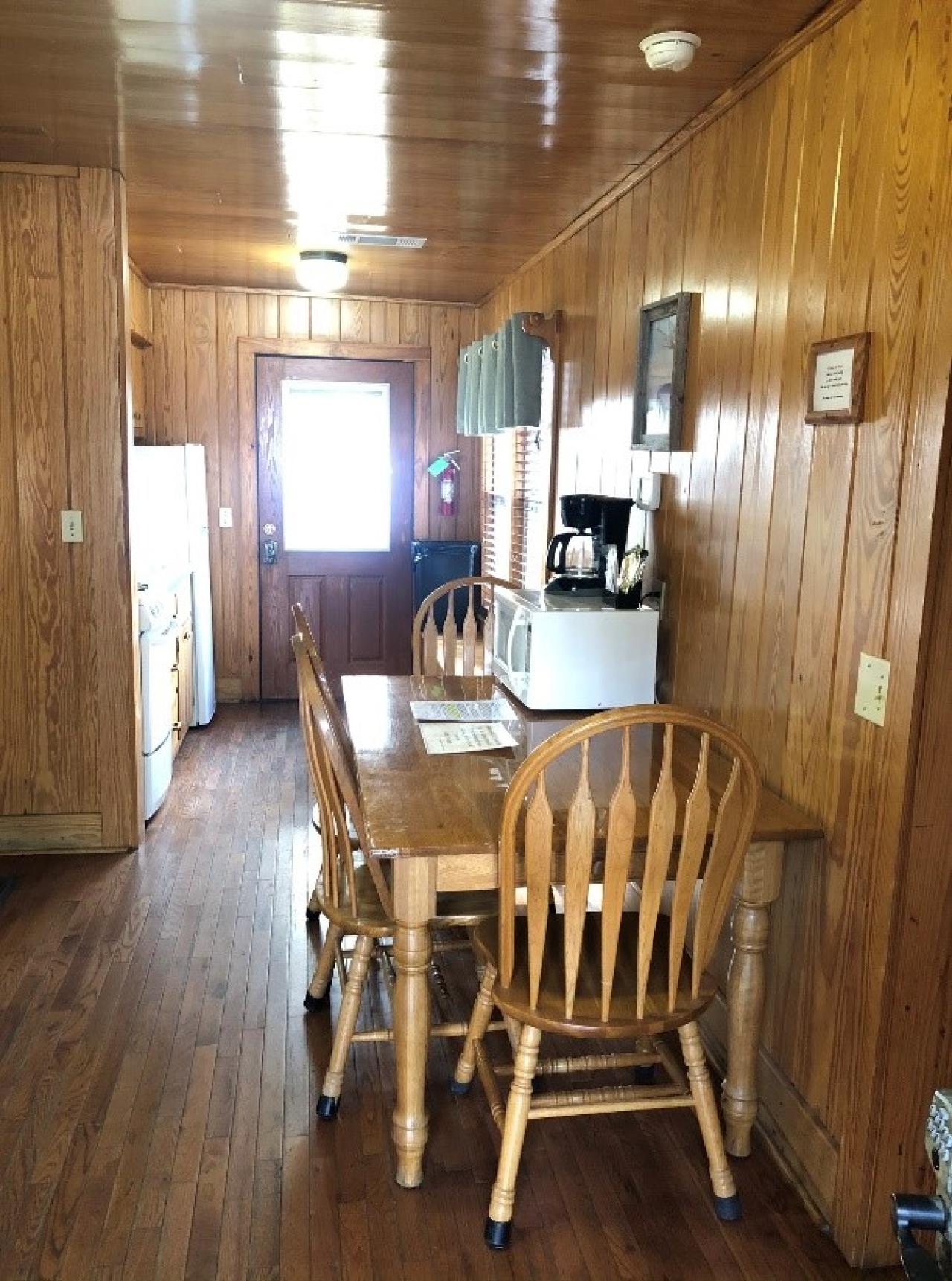 A view of the dining area and kitchen at Cabin 14 at Mount Nebo State Park