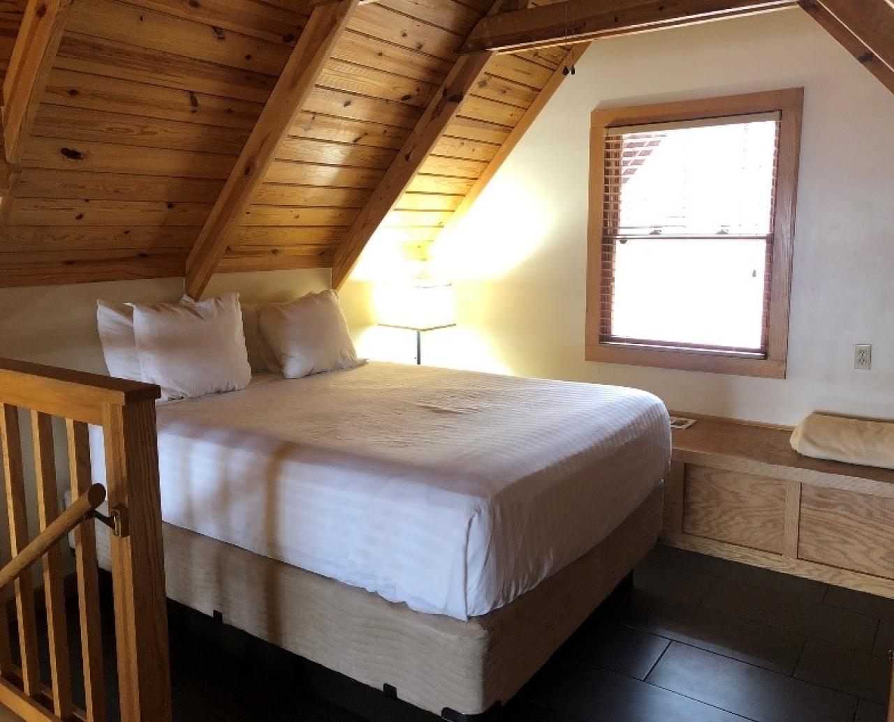 A view of the loft bedroom at Cabin 11 at Mount Nebo State Park