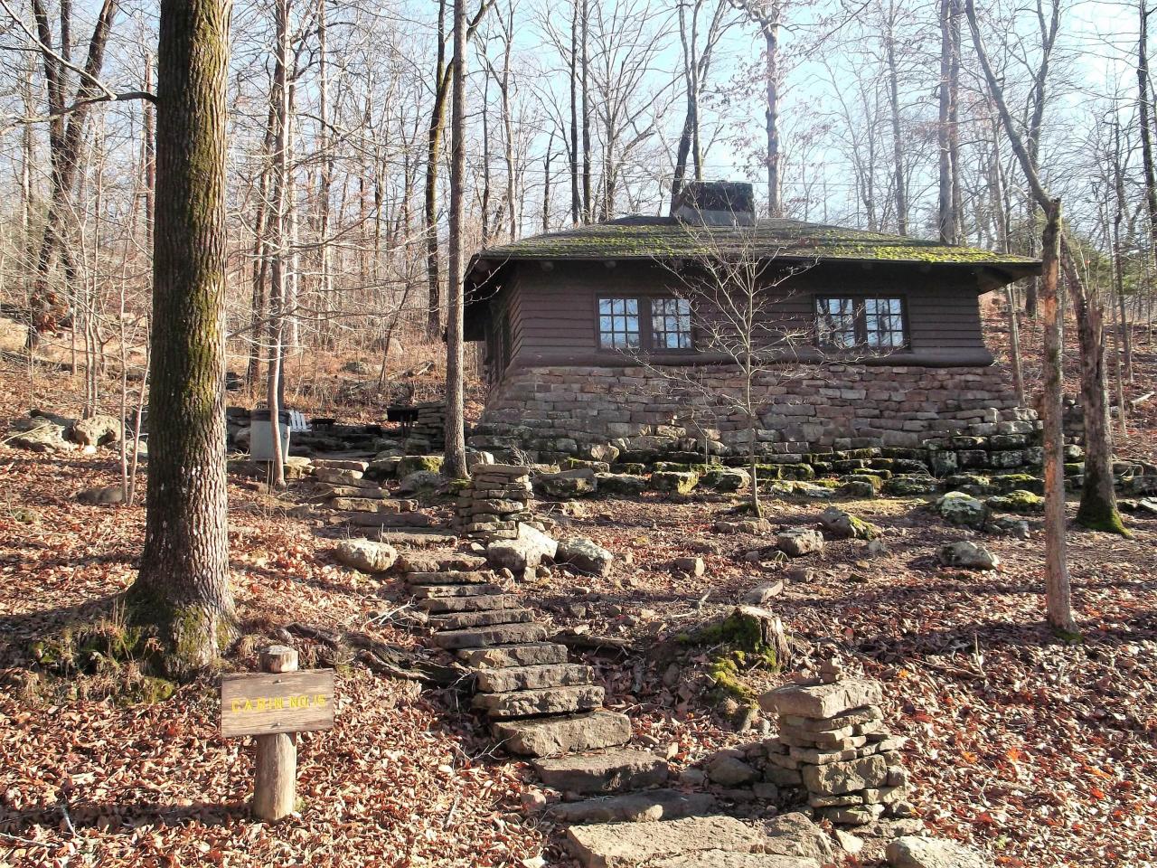 An exterior view of cabin 15 including the stone staircase leading to the front entrance