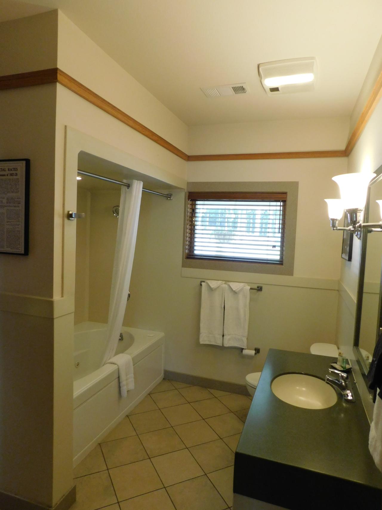 A full bathroom at Cabin 3 at Lake Ouachita State Park including a spa tub