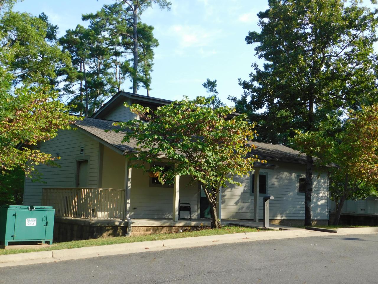 An exterior view of Cabin 4 at Lake Ouachita State Park including a front porch area