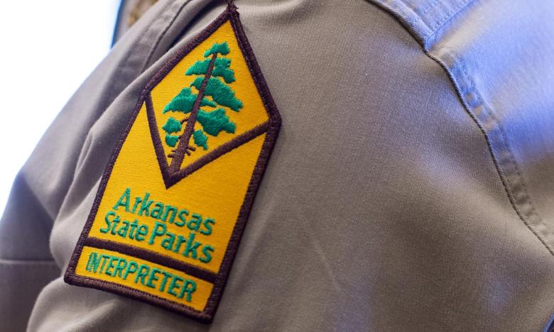 An Arkansas State Parks Interpreter patch on the staff uniform
