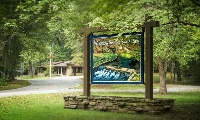 The entrance sign to Withrow Springs State Park.
