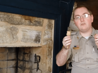 Powhatan Park Interpreter Geoffrey shows a game with a cup and ball