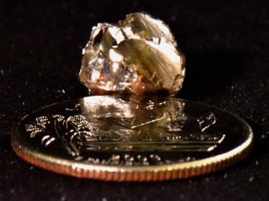 Kindard Friendship Diamond next to a quarter for scale