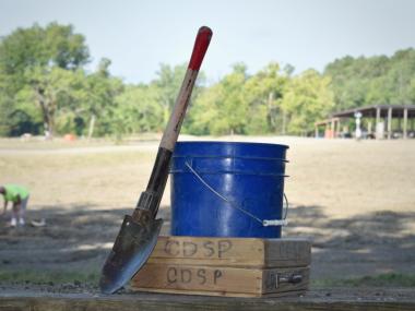 shovel, blue bucket and screen for searching for diamonds at Crater of Diamonds State Park