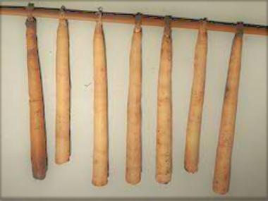 tallow candles hanging from stick