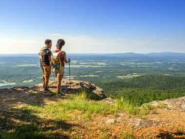 A couple looks out over the vista at Mount Magazine State Park