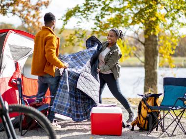 Couple setting up tent at Mississippi River State Park