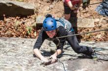 Monika Rued Arkansas State Parks Public Information Officer climbing at Mount Magazine State Park
