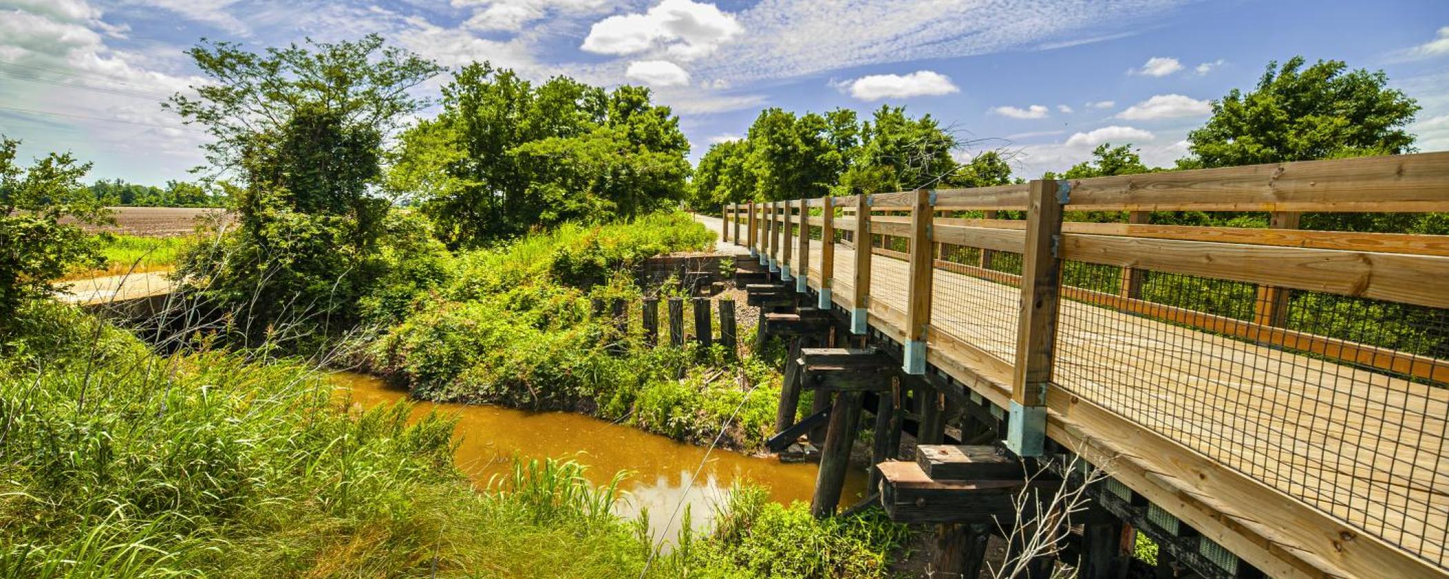 Wood bridge over marsh at Delta Heritage State Park