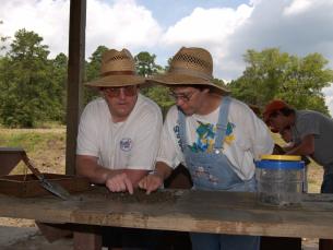 Couple water sifting for diamonds
