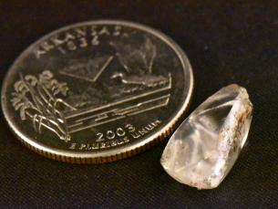 Serendipity diamond next to quarter for scale