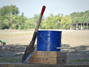 shovel, blue bucket and screen for searching for diamonds at Crater of Diamonds State Park
