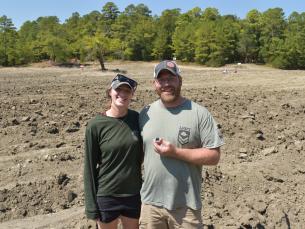 Jessica and Seth Erickson holding their 1.90-carat diamond on the search field at Crater of Diamonds State Park