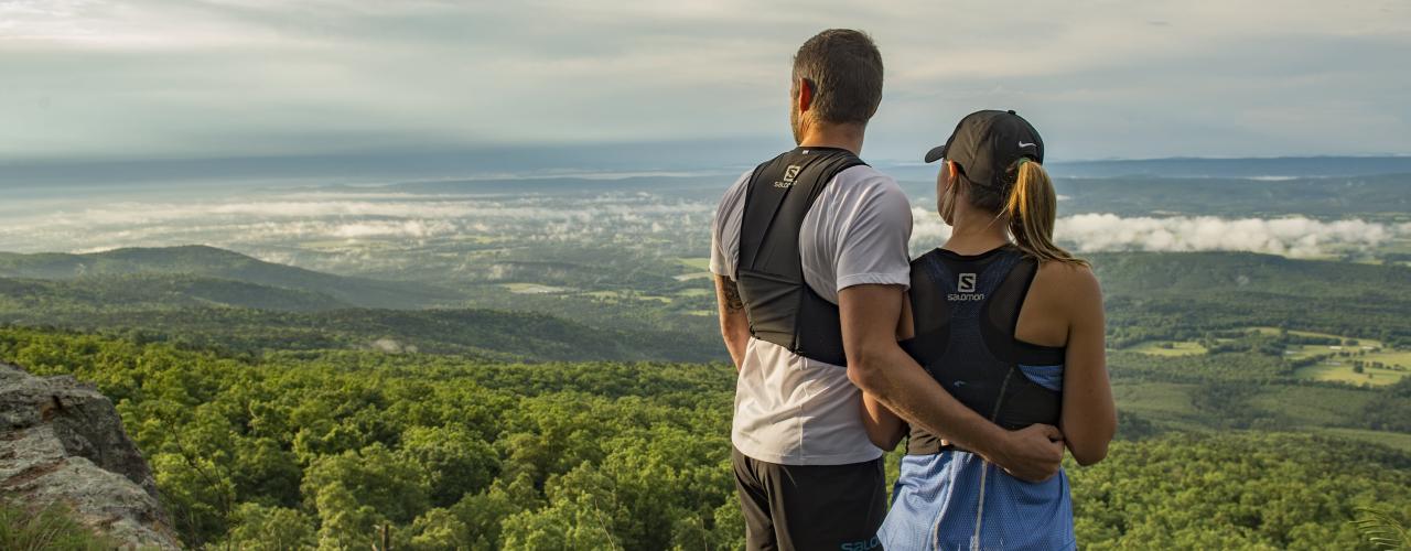 A couple looking over a beautiful view from the top of Mount Magazine