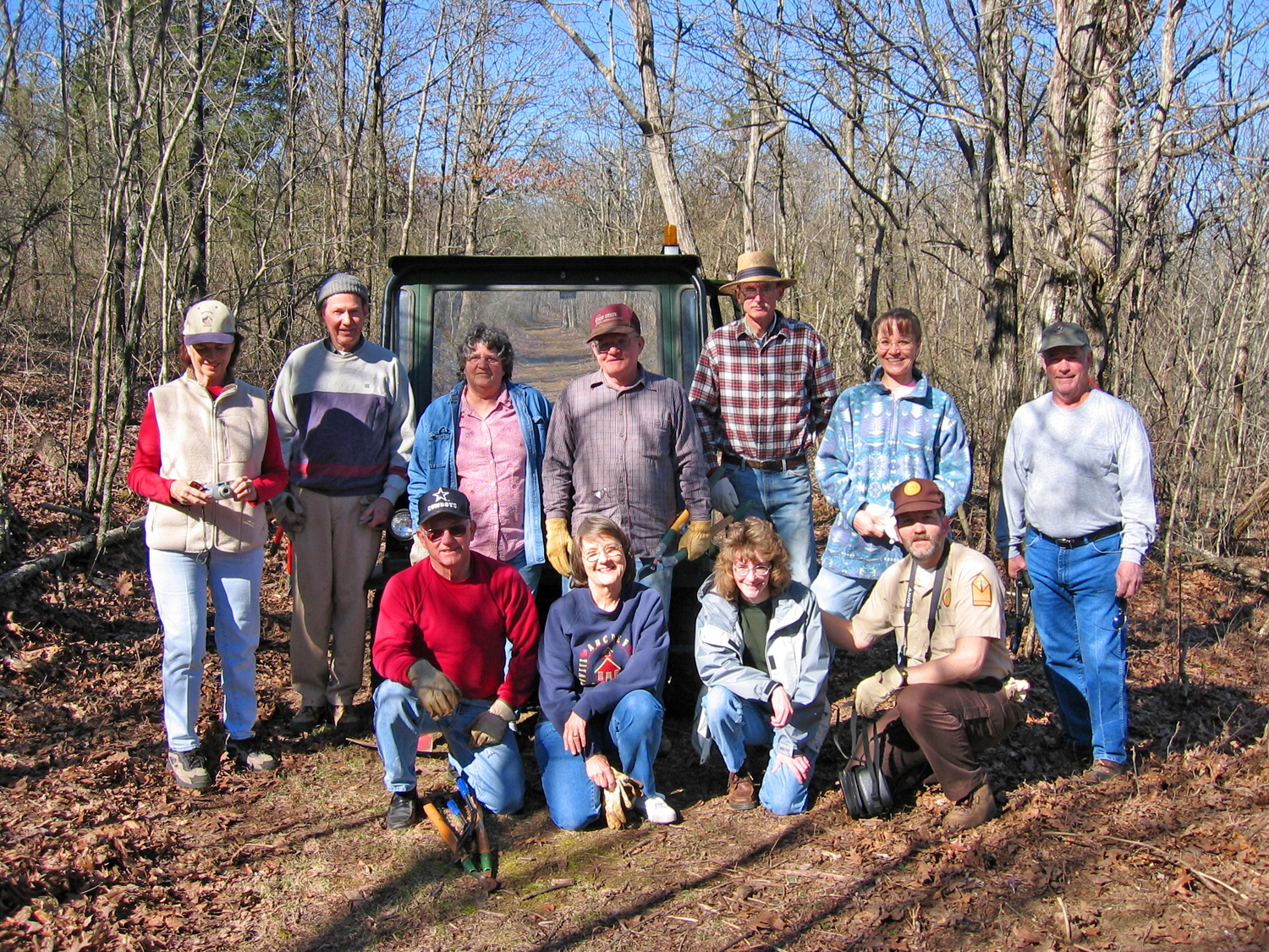 Volunteers clean out Historic Buckman's Pool on the Will Apple's Road Trail.