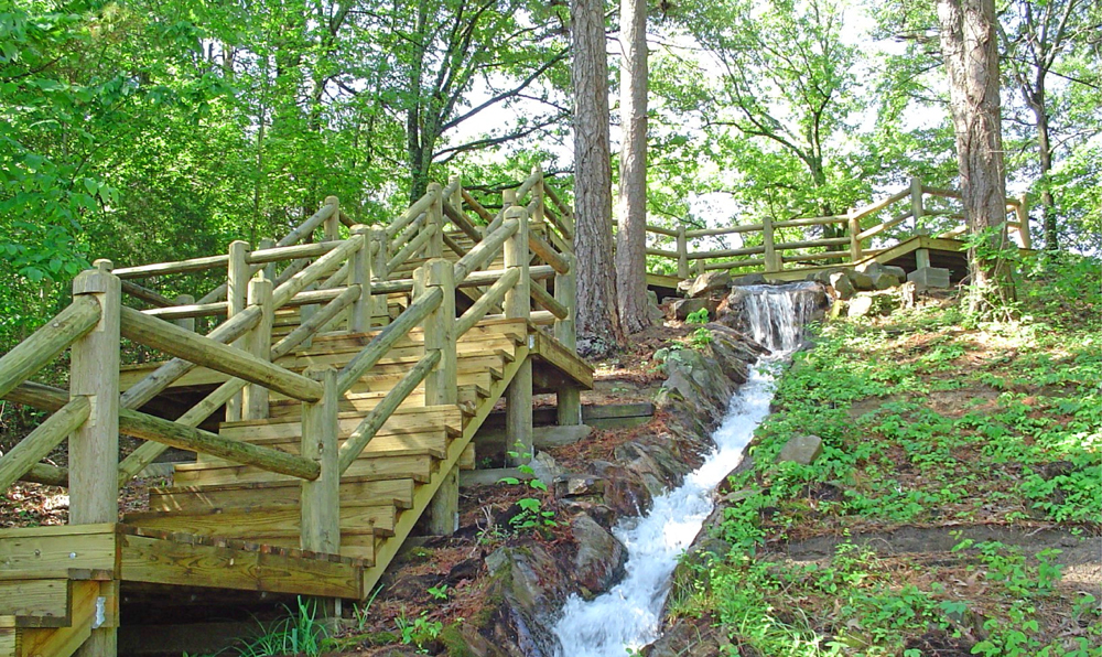 The Wishing Well Flume near Lake Ponder is surrounded by greenery.